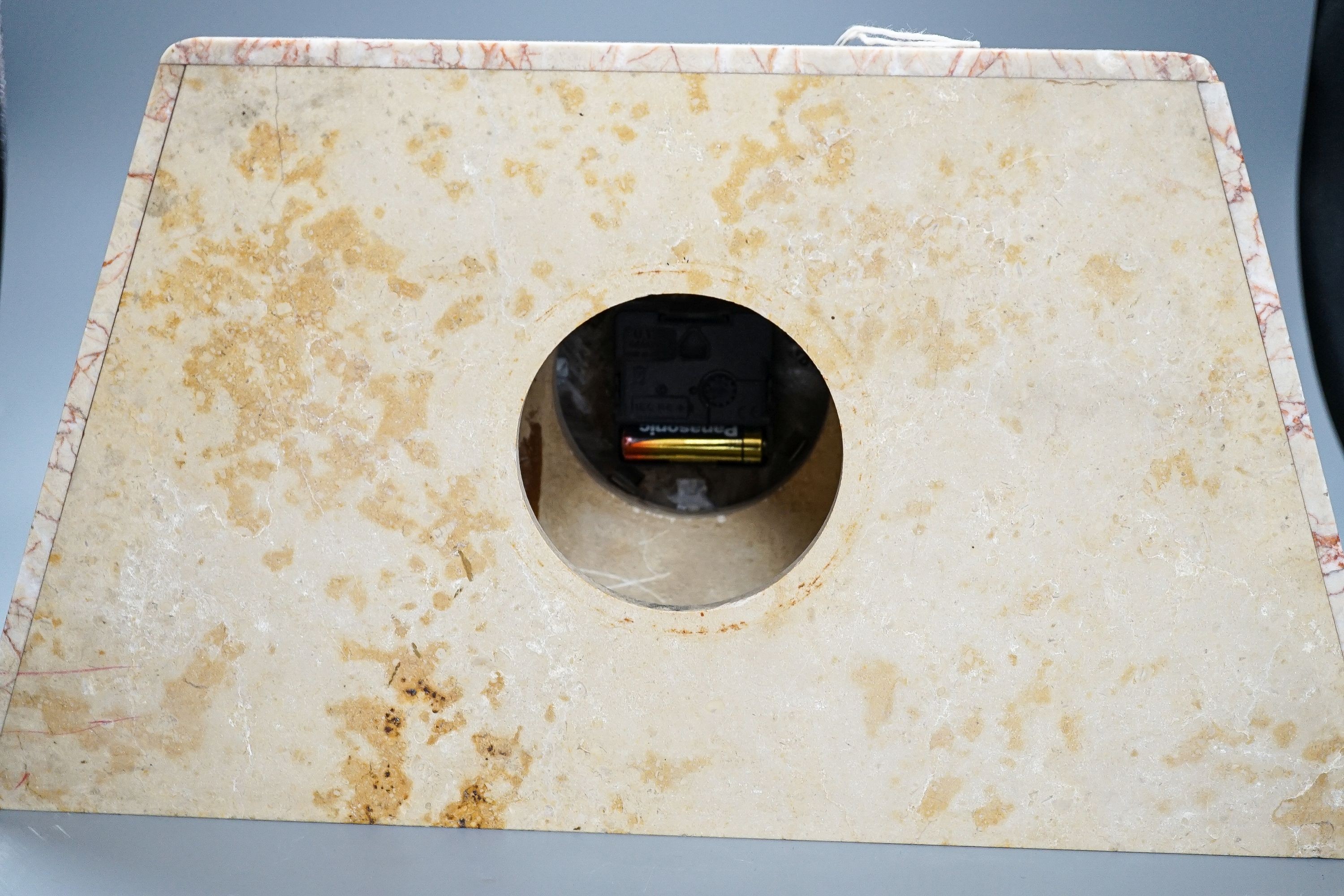 An Art Deco rouge marble mantel timepiece, 45cm wide, quartz movement replacement and a brass anniversary clock under glass dome